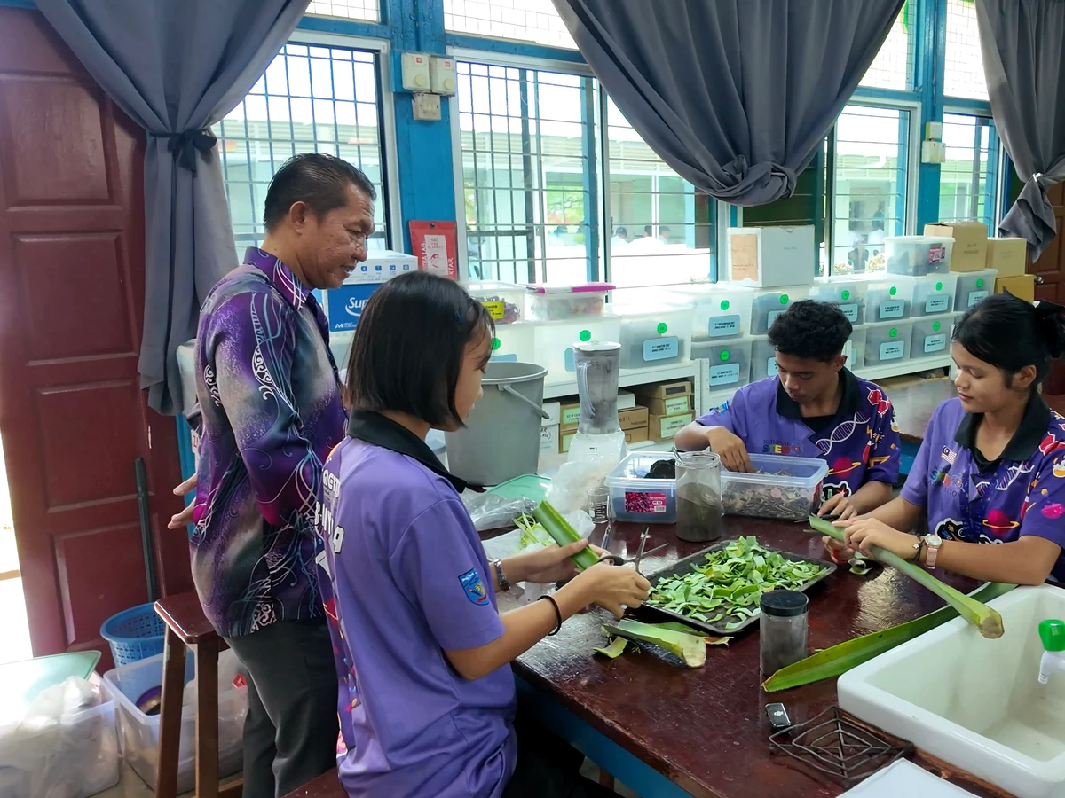 Secondary school STEM team processing plant materials for botanical extraction research